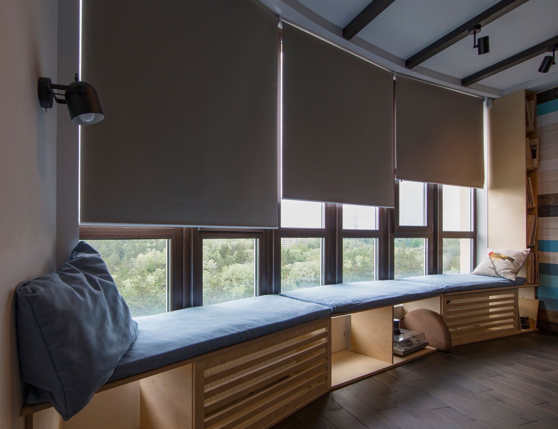 Interior room showcasing commercial window treatment with modern roller blinds.