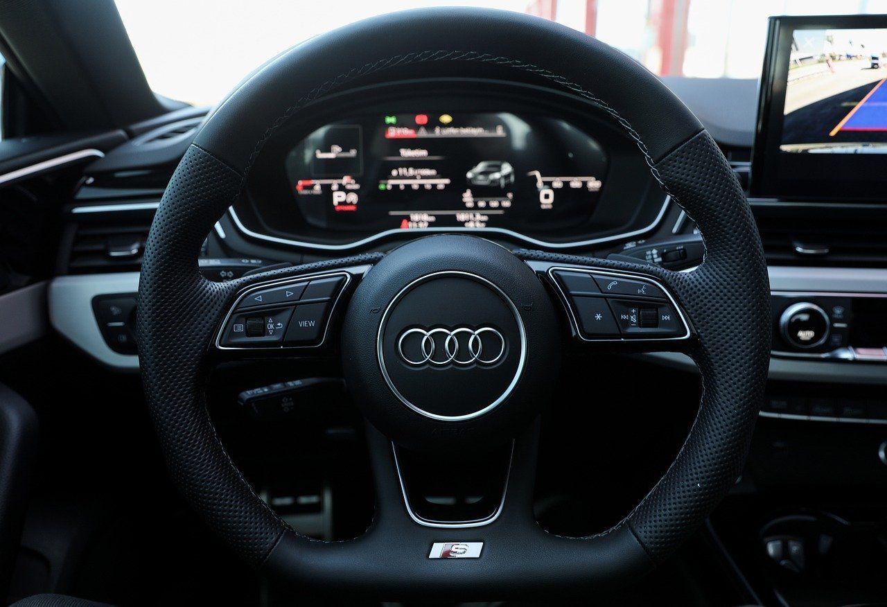 Audi digital cockpit and steering wheel interior with illuminated dashboard displays