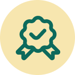 A dark green icon of a scalloped badge with a checkmark and ribbon tails, centered on a light yellow circle.
