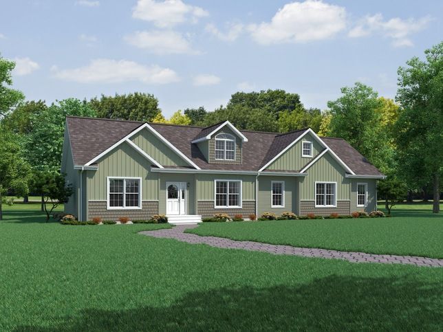 Suburban house with green siding, a curved walkway, and a large grassy yard under a partly cloudy sky