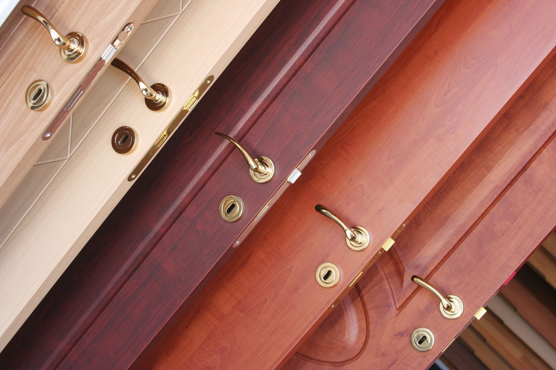 A row of wooden doors with brass handles