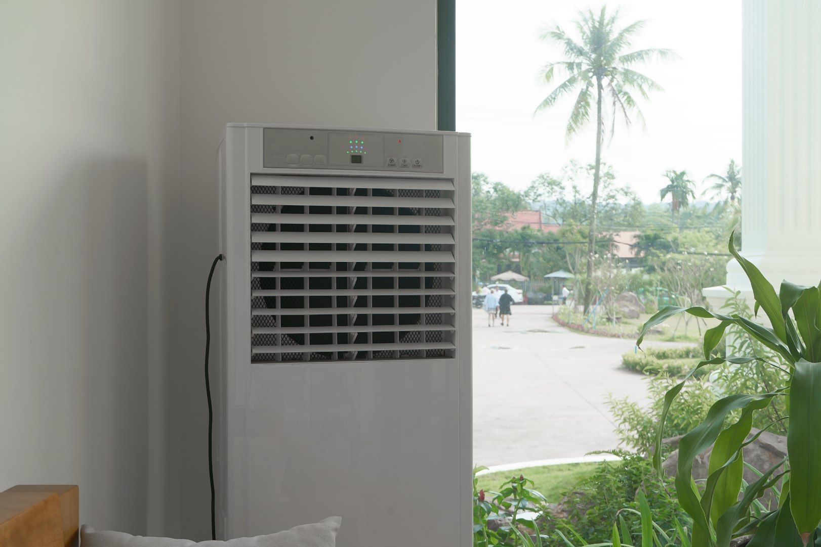 A Large Air Conditioner is Sitting in a Room Next to a Window — North West Heating, Cooling and Refrigeration in Scone, NSW