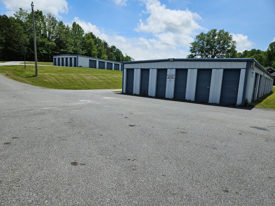 A long hallway filled with blue and white storage units.