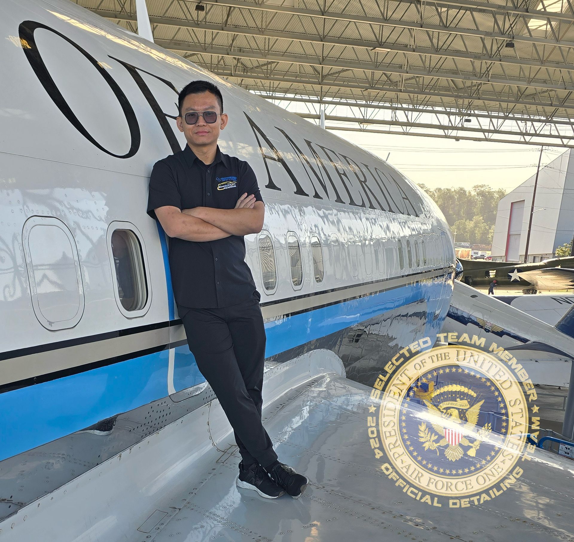 A man leaning against a plane
