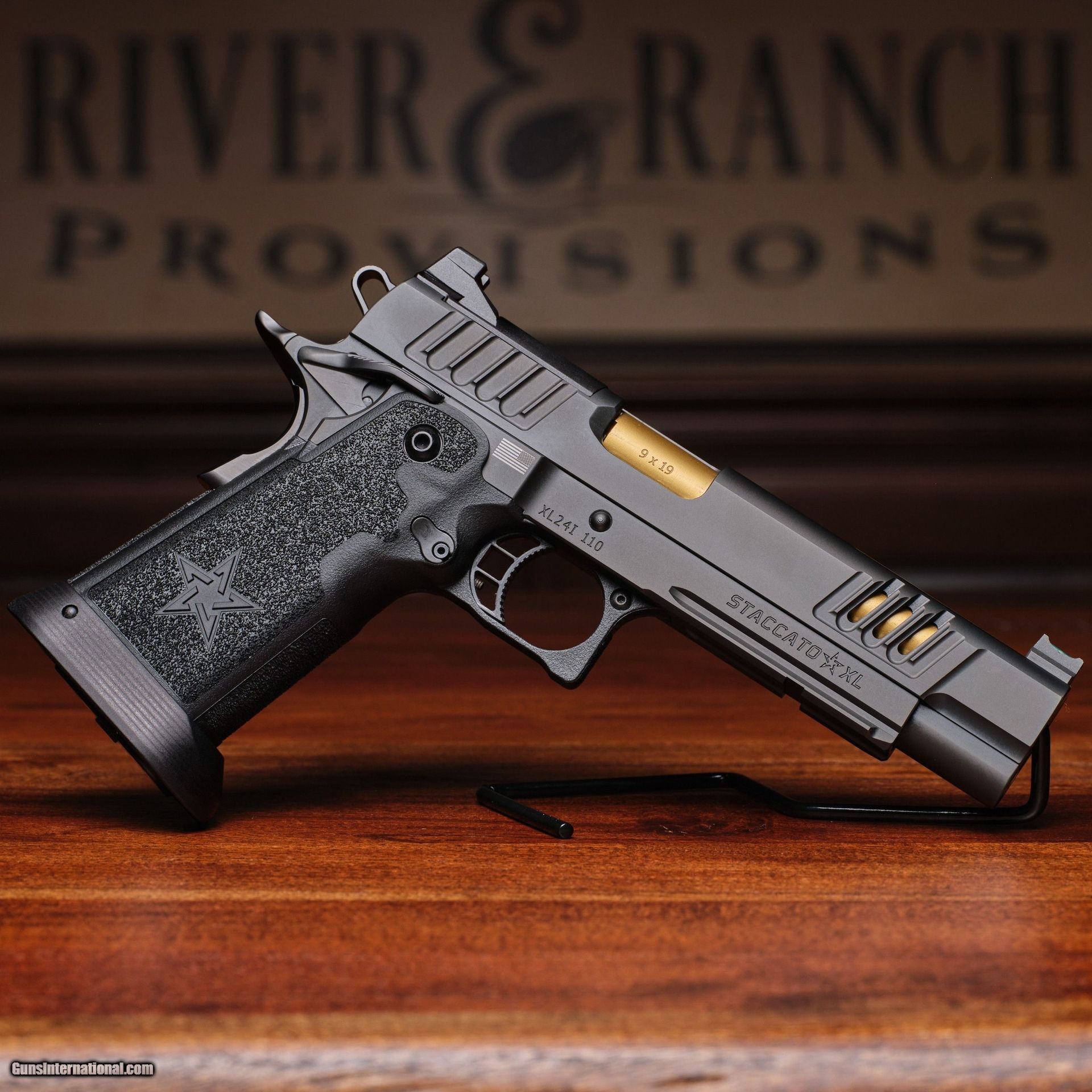 A river & ranch pistol is sitting on a wooden table