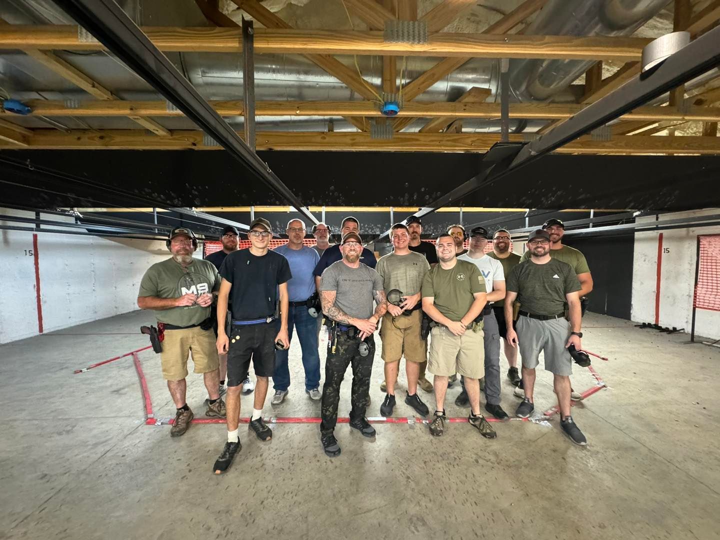 A group of men are posing for a picture in a room.