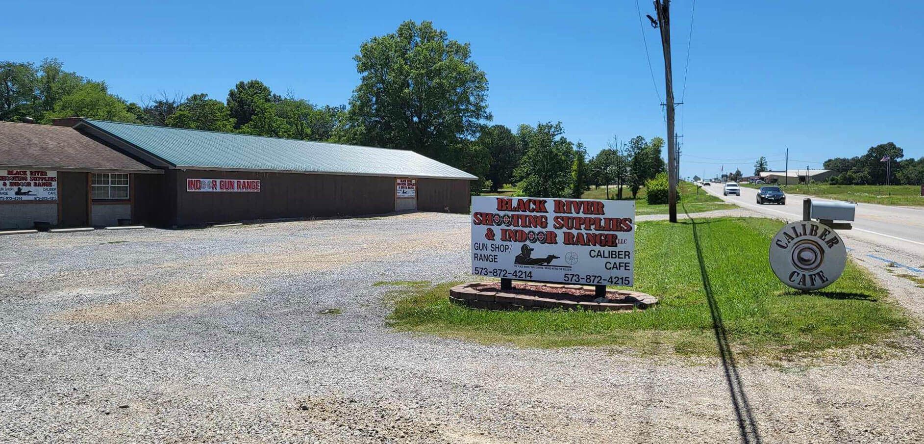 A sign in front of a building that says ' black duck ' on it