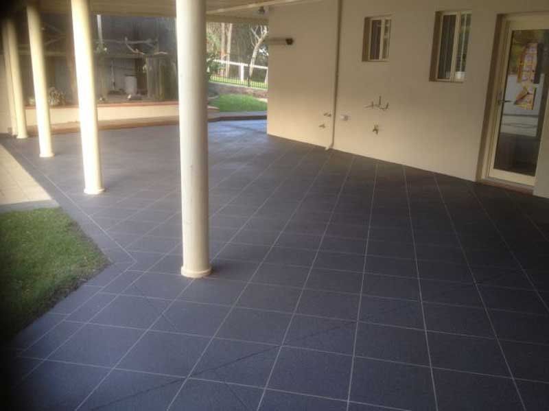 dark tile spray on flooring