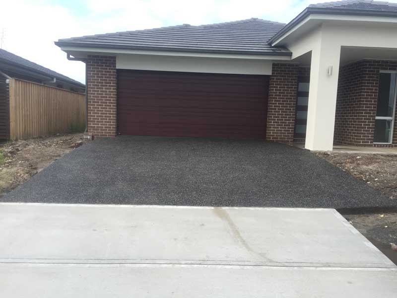 home with new concrete driveway