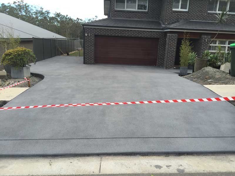 front view of home with new concrete driveway