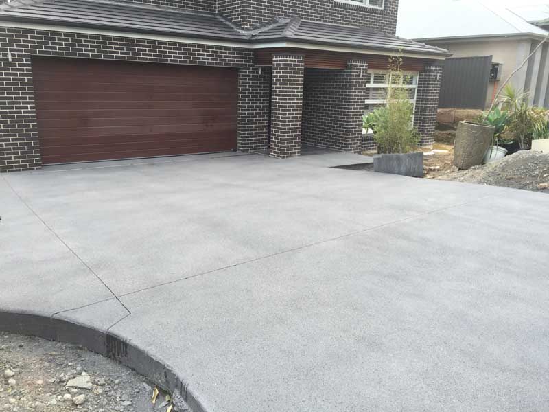 home with nice new concrete driveway