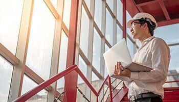 Civil Engineers — Young Engineer Working With A Laptop in Fort Worth, TX