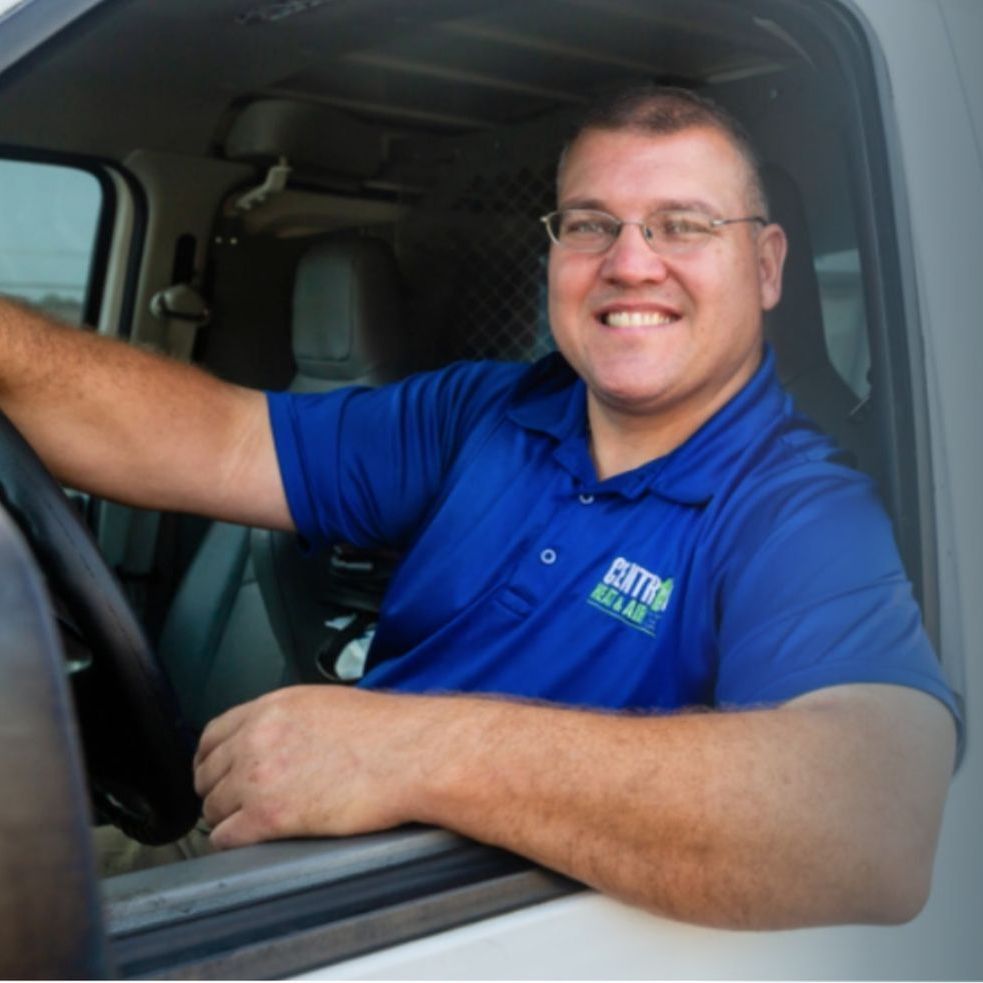 A man wearing a blue shirt that says extra on it