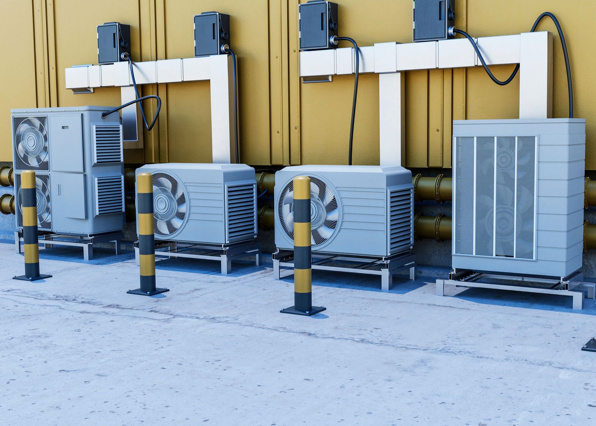 A row of air conditioners are lined up in front of a building.