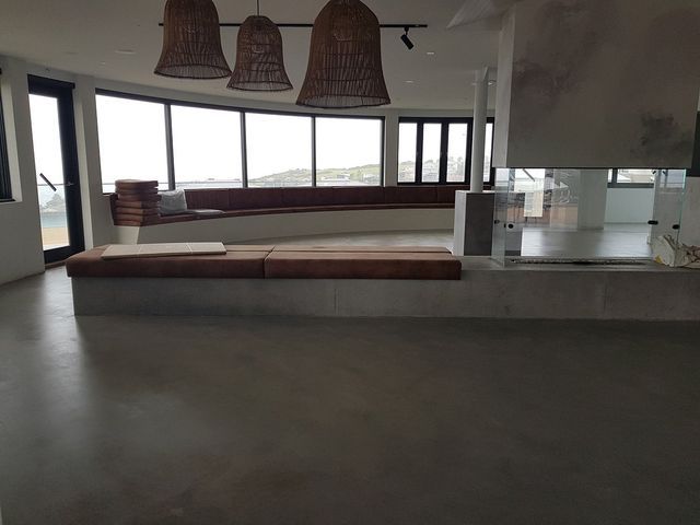 concrete bench under a window with overlooking views