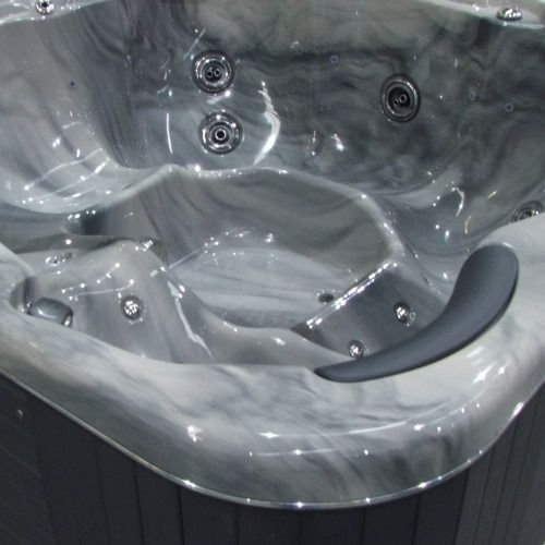 A Close Up Of A Gray Hot Tub With A Black Base — Dazzling Blue Pool & Spa Centre Gold Coast in Mermaid Waters, QLD