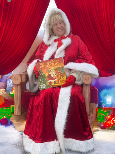 Woman in Santa suit holding