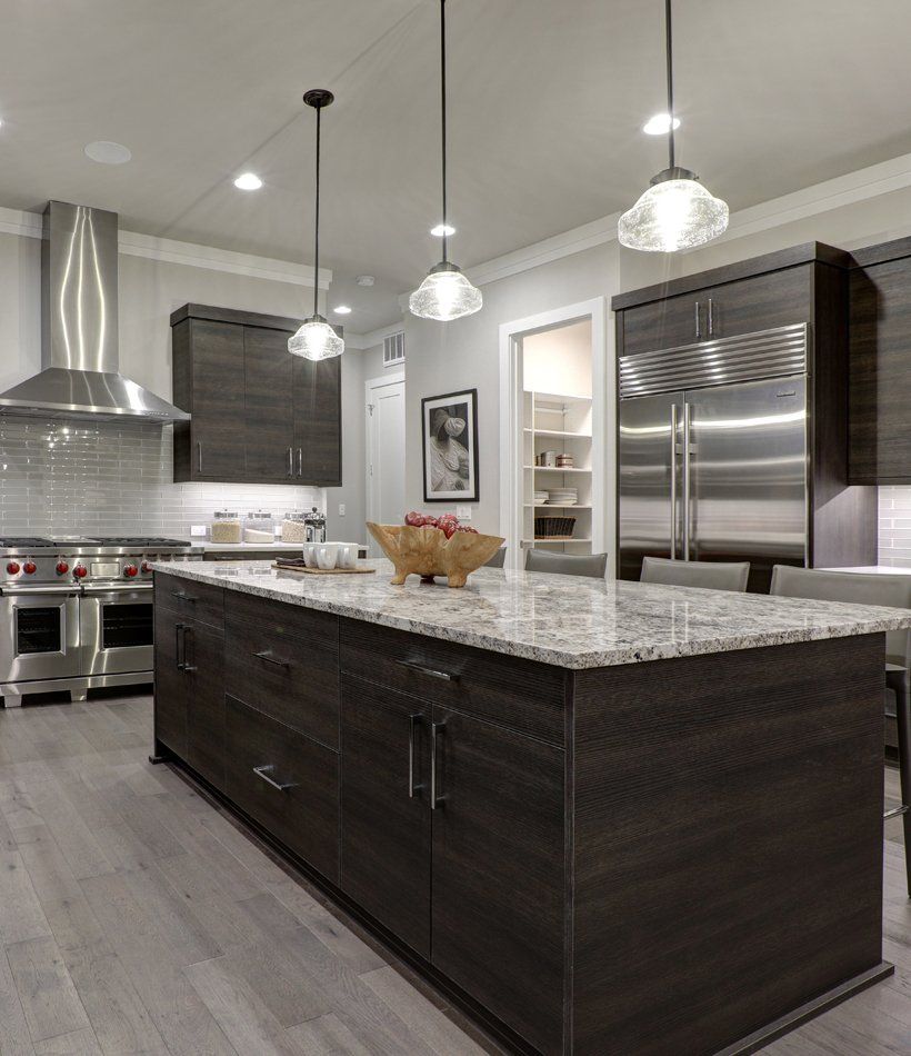 Modern Gray Kitchen Features Dark Gray Flat Front Cabinets