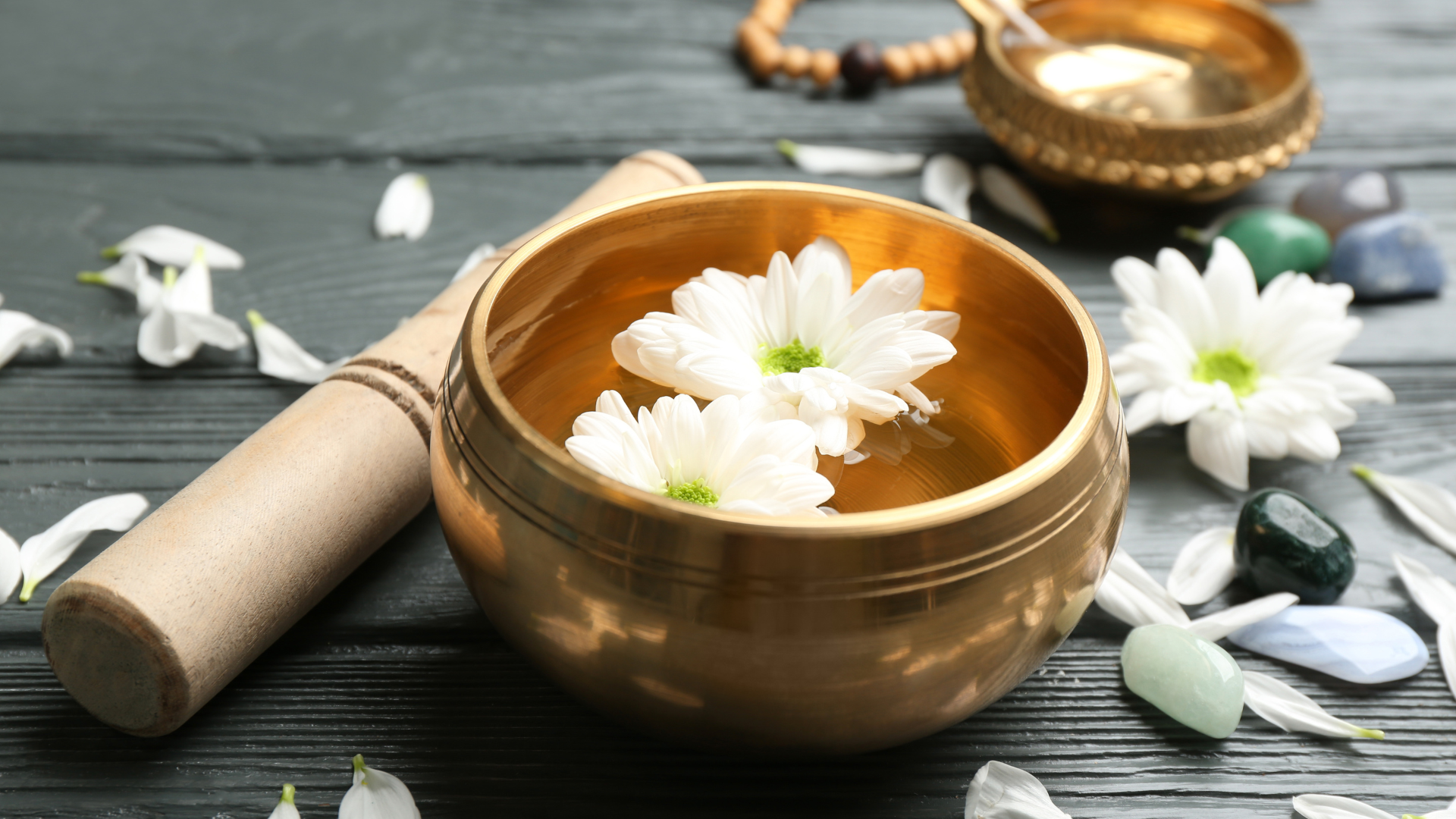 A man is getting a hot stone massage at a spa.