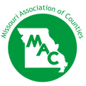The missouri association of counties logo is a green circle with a map of missouri inside of it.