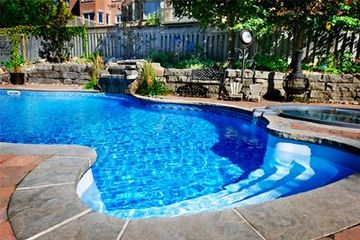 Pumps Service & Repair — Swimming Pool with Waterfall in Gainesville, FL