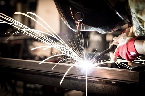 Tooling Services — Worker Welding Steel in Lincoln, RI