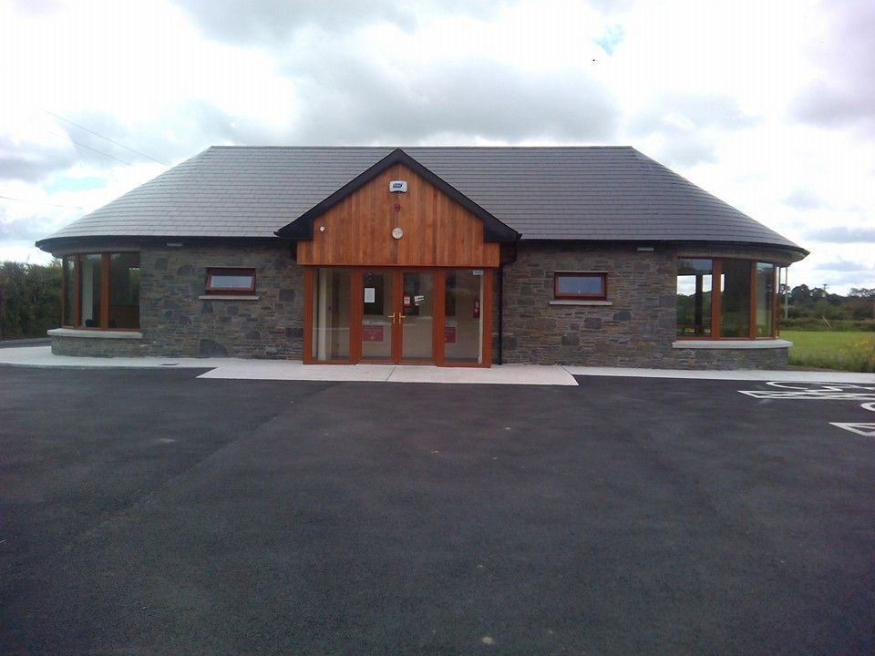 A house with a roof that has a roof number on it