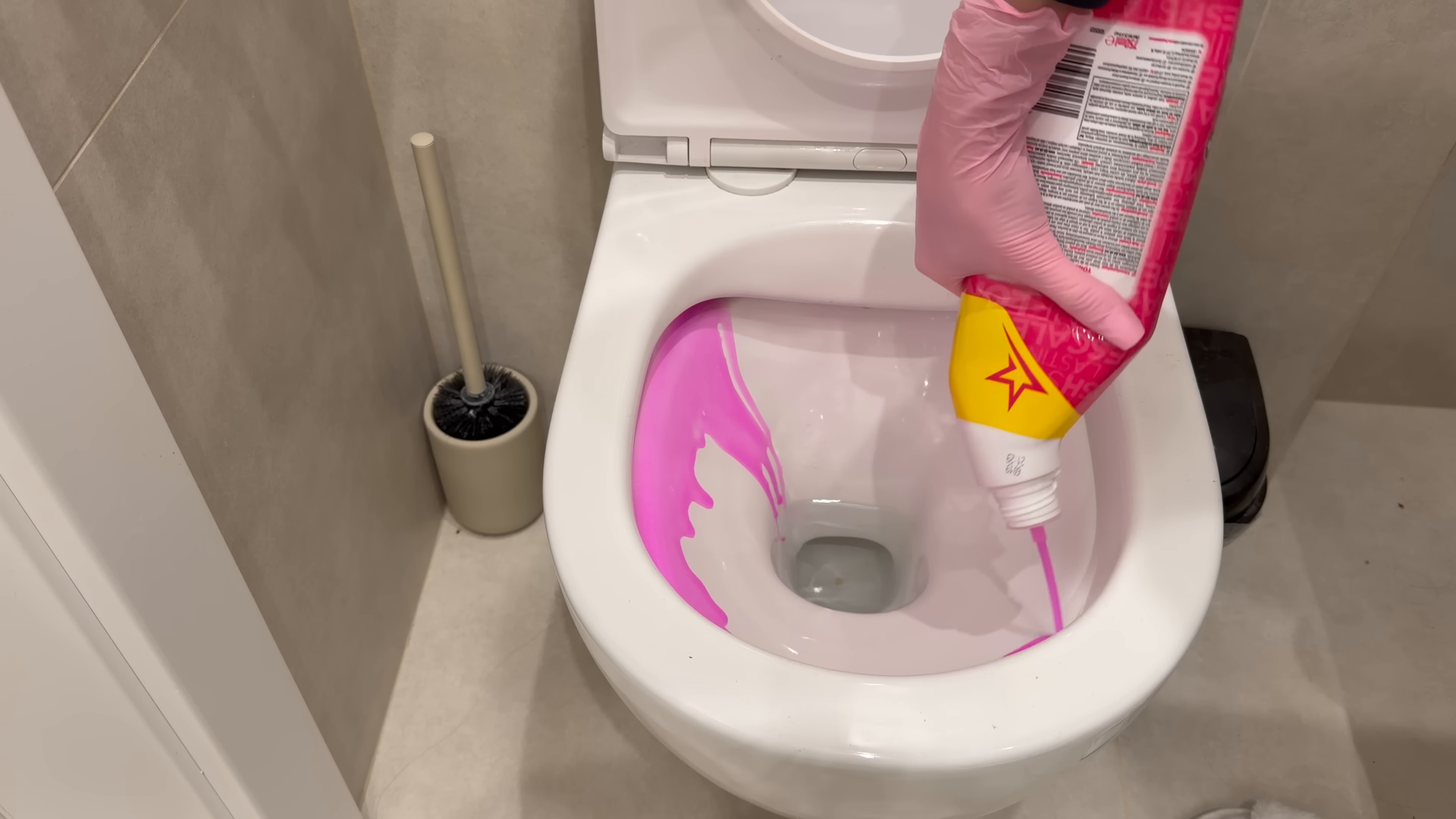Professional cleaner wiping kitchen surfaces in a Steinway Queens apartment