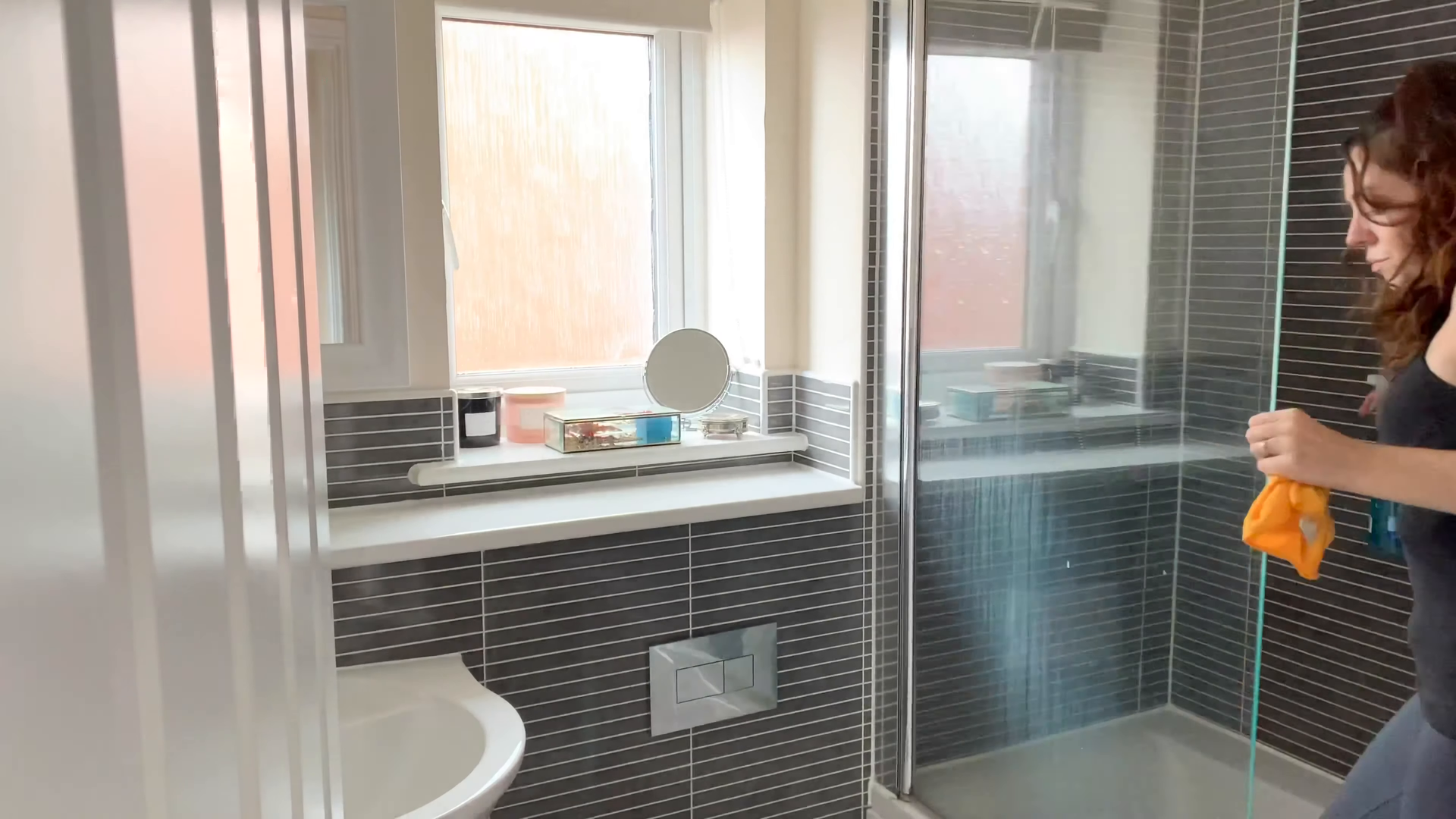 Professionally trained house cleaner polishing surfaces in an Upper East Side apartment, Manhattan