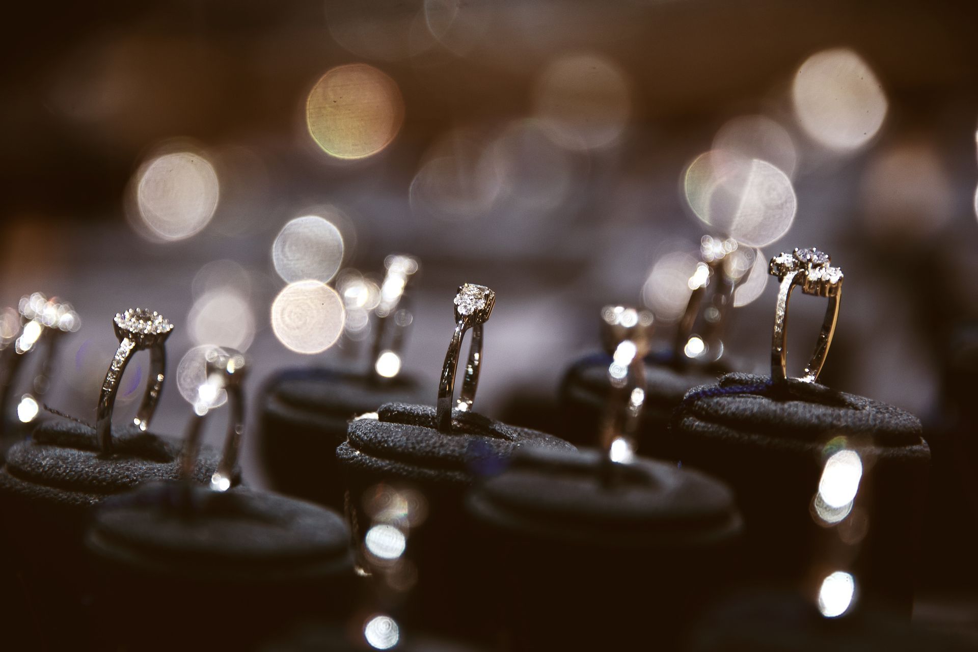 A Row of Rings Sitting on Top of Each Other on Display in a Store — K. Smith & Son Jewellers In Caloundra, QLD