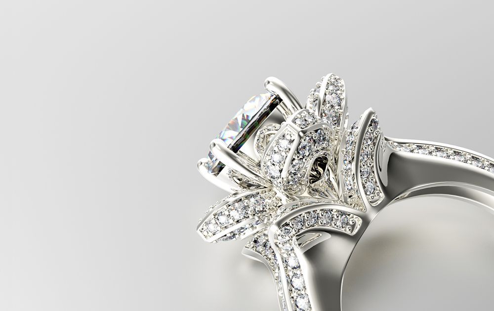 A Close Up of a Diamond Ring on a White Surface — K. Smith & Son Jewellers In Caloundra, QLD