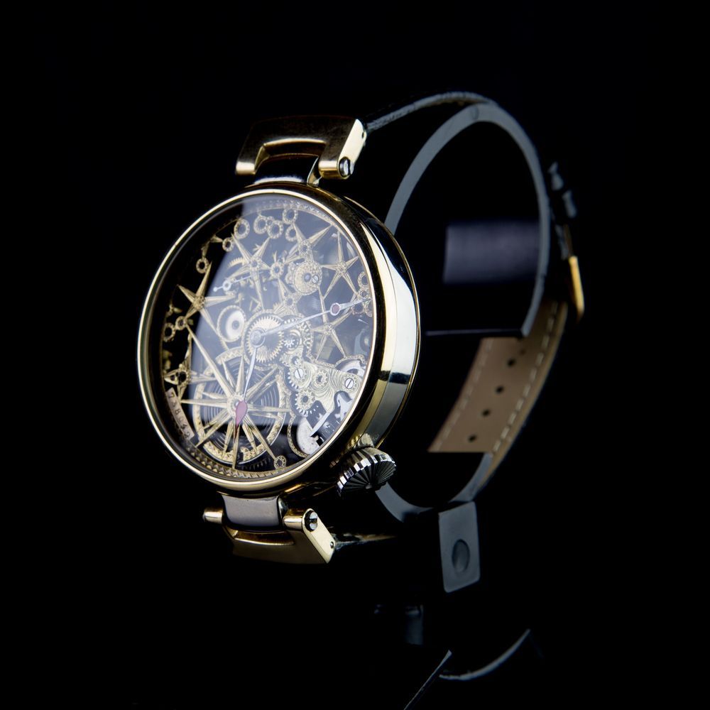 A Gold Watch With a Skeleton Face on a Black Background — K. Smith & Son Jewellers In Caloundra, QLD