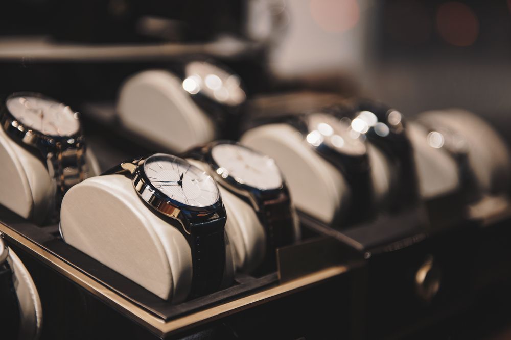 A Row of Watches Are Lined Up on Display in a Case — K. Smith & Son Jewellers In Caloundra, QLD