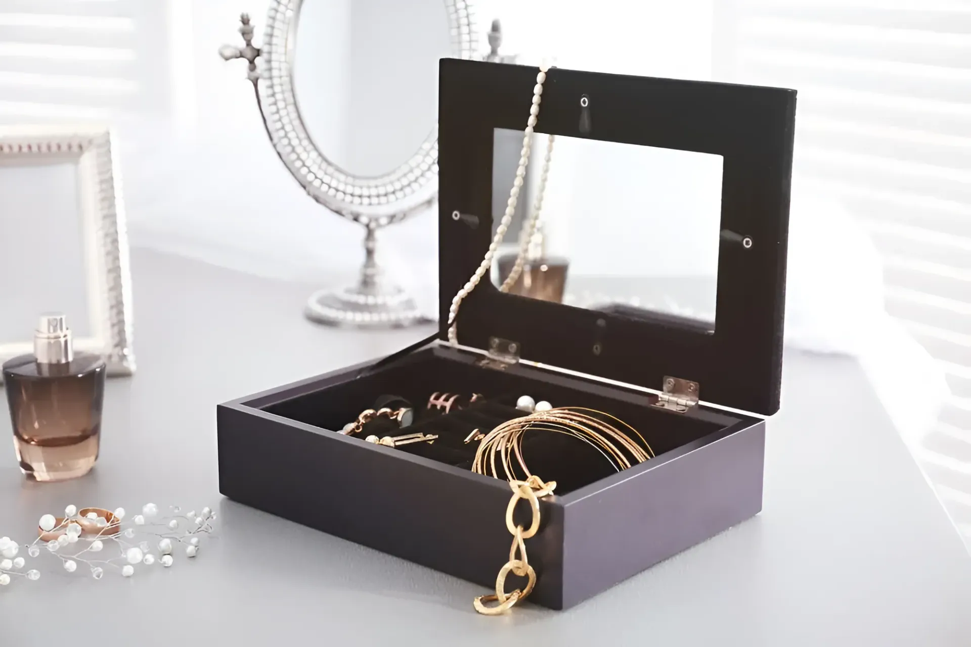 A Wooden Jewelry Box Filled With Necklaces and Bracelets on a Table — K. Smith & Son Jewellers In Caloundra, QLD