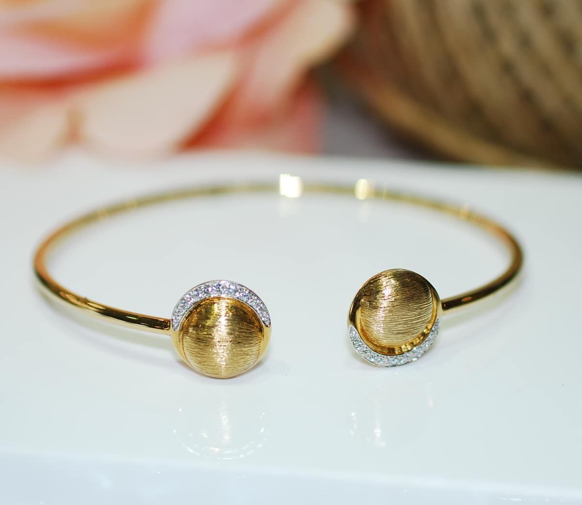 Gold Open Cuff Bracelet with Two Ball-Shaped Ends; One Is Textured and The Other Appears to Have Small White Stones — K. Smith & Son Jewellers In Caloundra, QLD