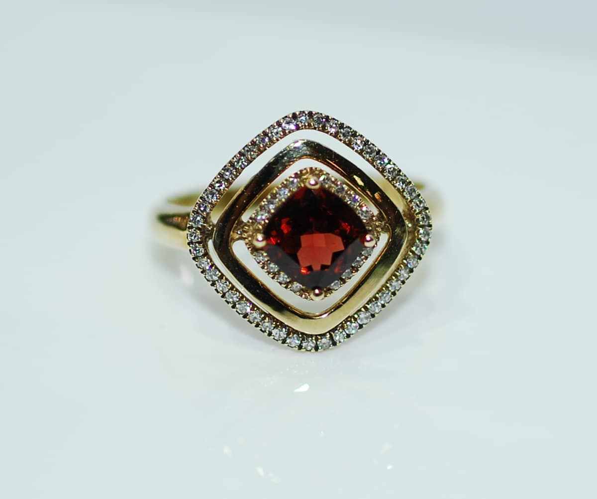 A Large, Elaborate Ring with A Central, Dark Purple Gemstone Surrounded by Smaller, Colourful Stones — K. Smith & Son Jewellers In Caloundra, QLD