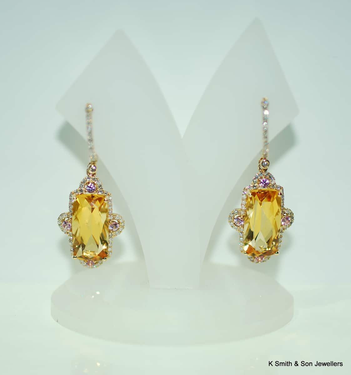 Gold Drop Earrings with Rectangular Yellow Gems Displayed on White Stands — K. Smith & Son Jewellers In Caloundra, QLD