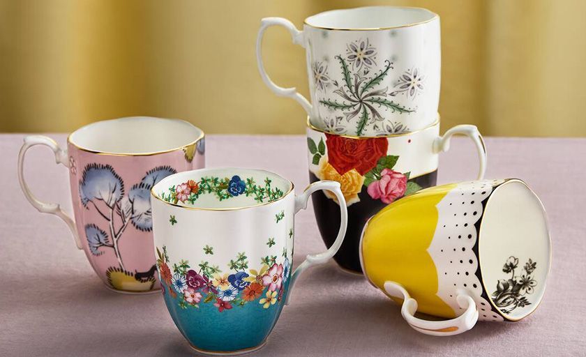 A Bunch of Gold Jewelry is Sitting on Top of a Pile of Gold Coins — K. Smith & Son Jewellers In Caloundra, QLD