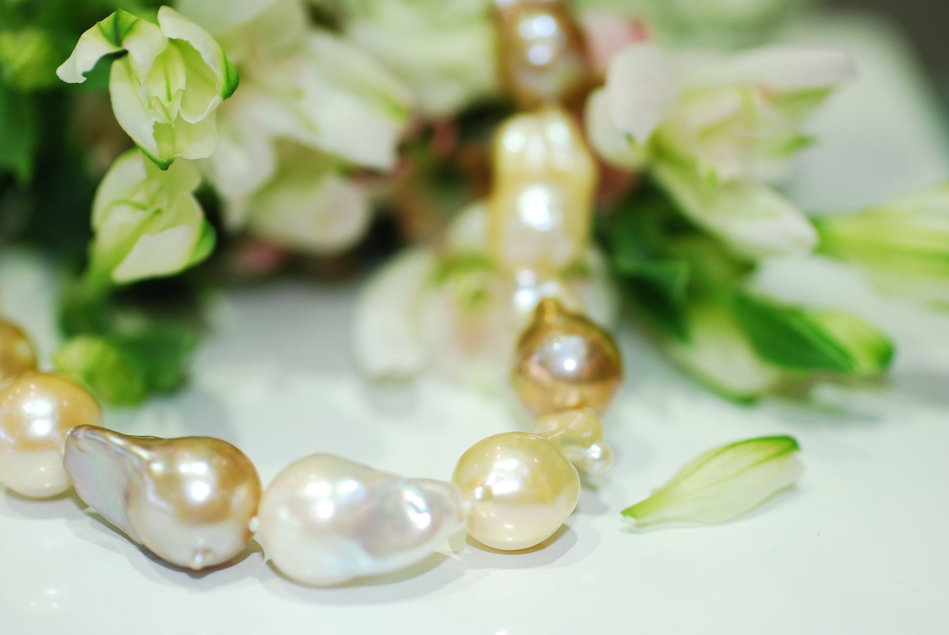 Pearl Necklace on Brown Satin Fabric — K. Smith & Son Jewellers In Caloundra, QLD