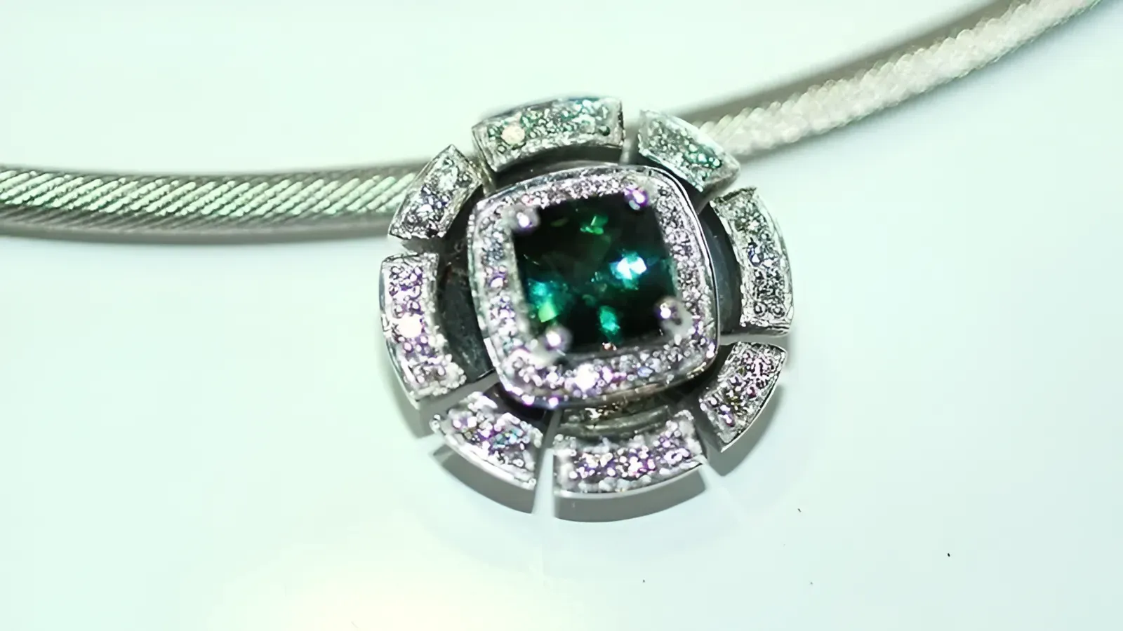 A Close Up of a Necklace With a Green Stone and Diamonds — K. Smith & Son Jewellers In Caloundra, QLD