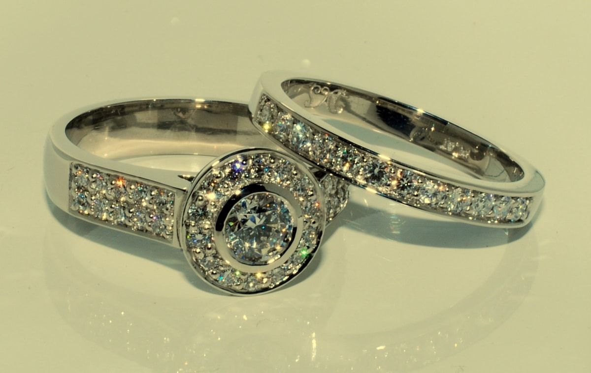 A Couple of Wedding Rings Sitting on Top of Each Other — K. Smith & Son Jewellers In Caloundra, QLD