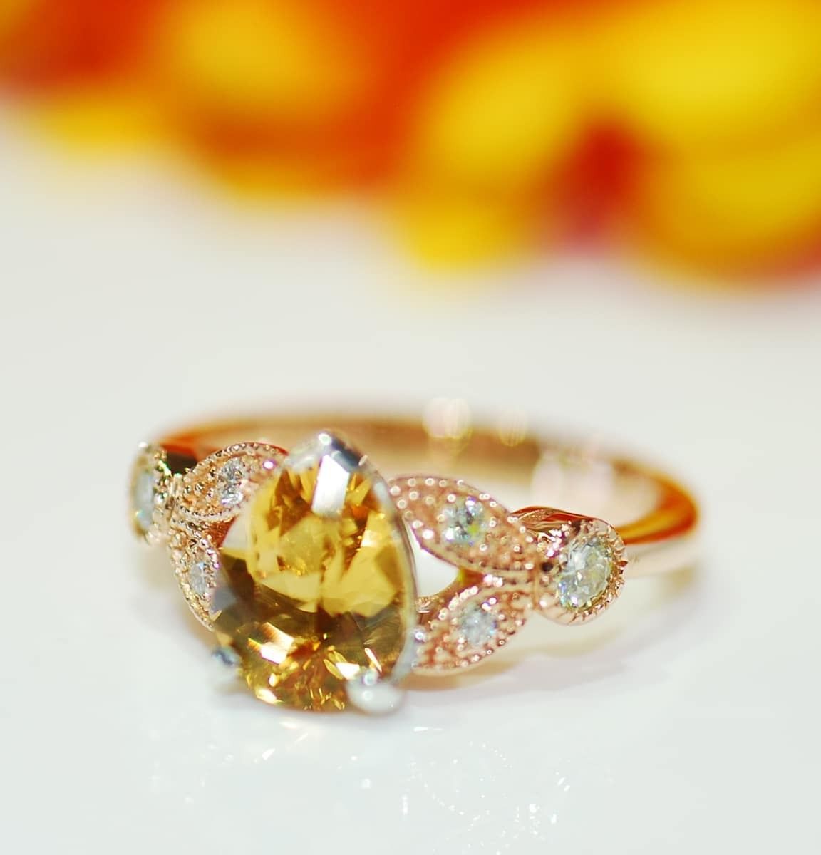 A Close Up of a Ring With a Yellow Stone — K. Smith & Son Jewellers In Caloundra, QLD