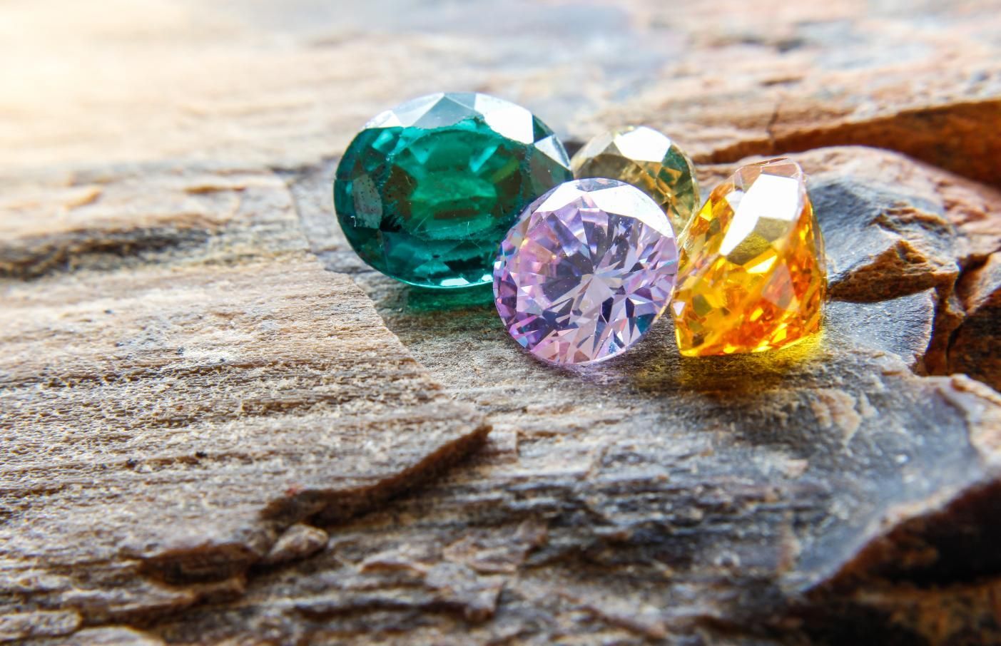 Four Colorful Gemstones Green, Yellow, Pink, and Orange — K. Smith & Son Jewellers In Caloundra, QLD