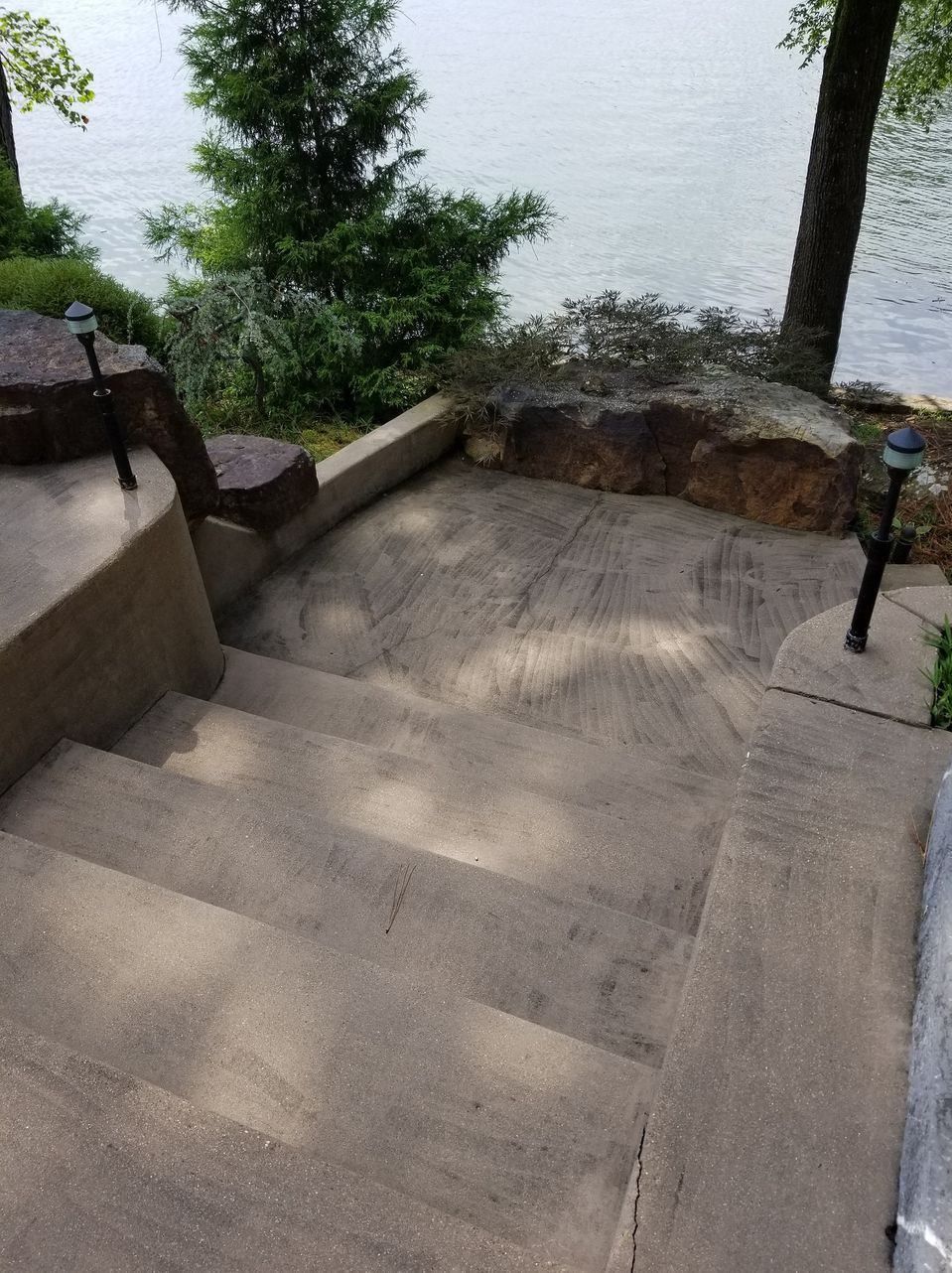 A set of stairs leading up to a body of water.