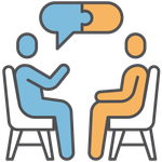 A doctor is talking to a patient in a dental chair.