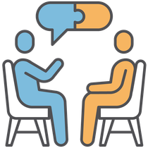 A doctor is talking to a patient in a dental chair.