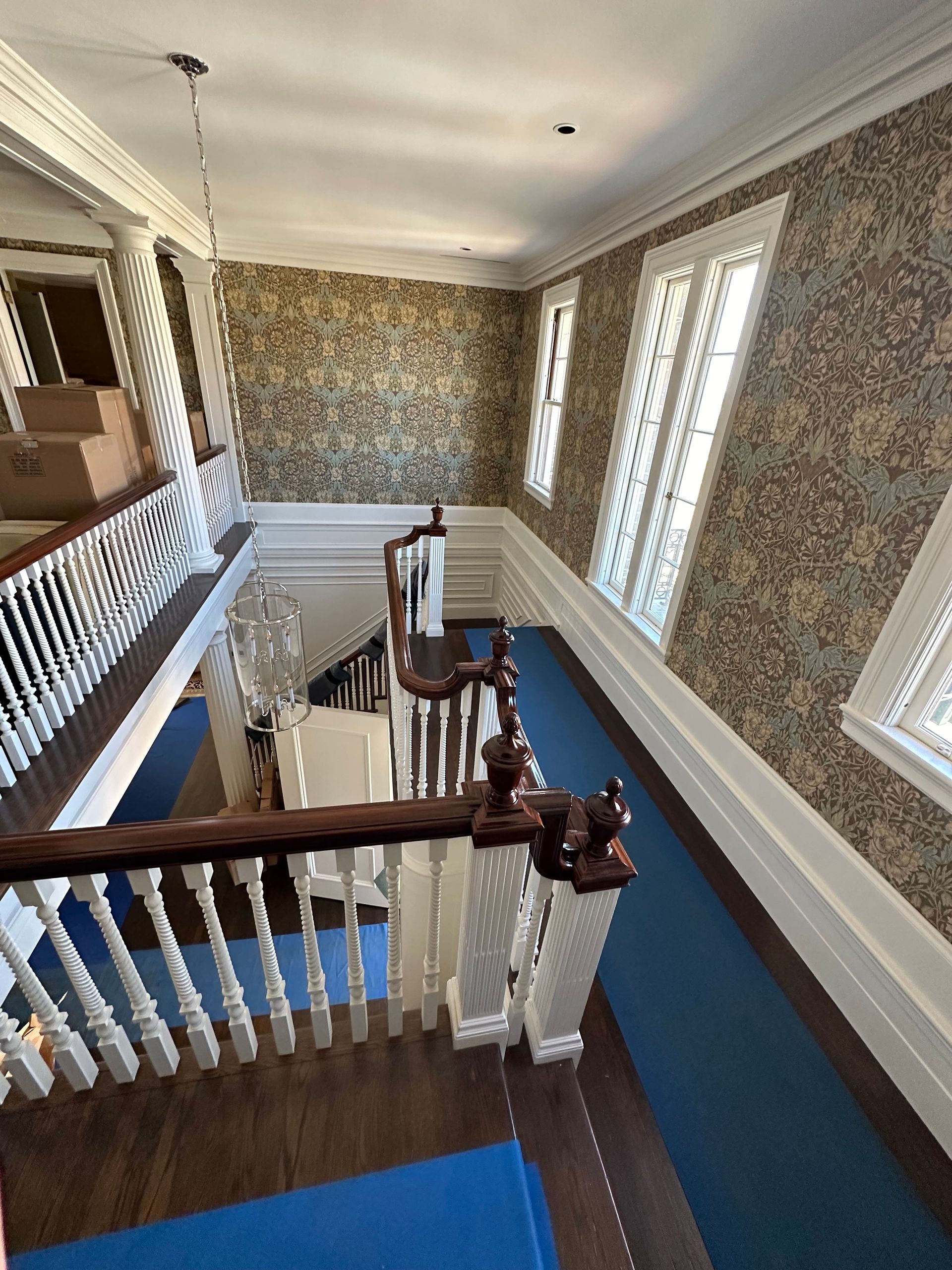A view of a staircase from the second floor of a house