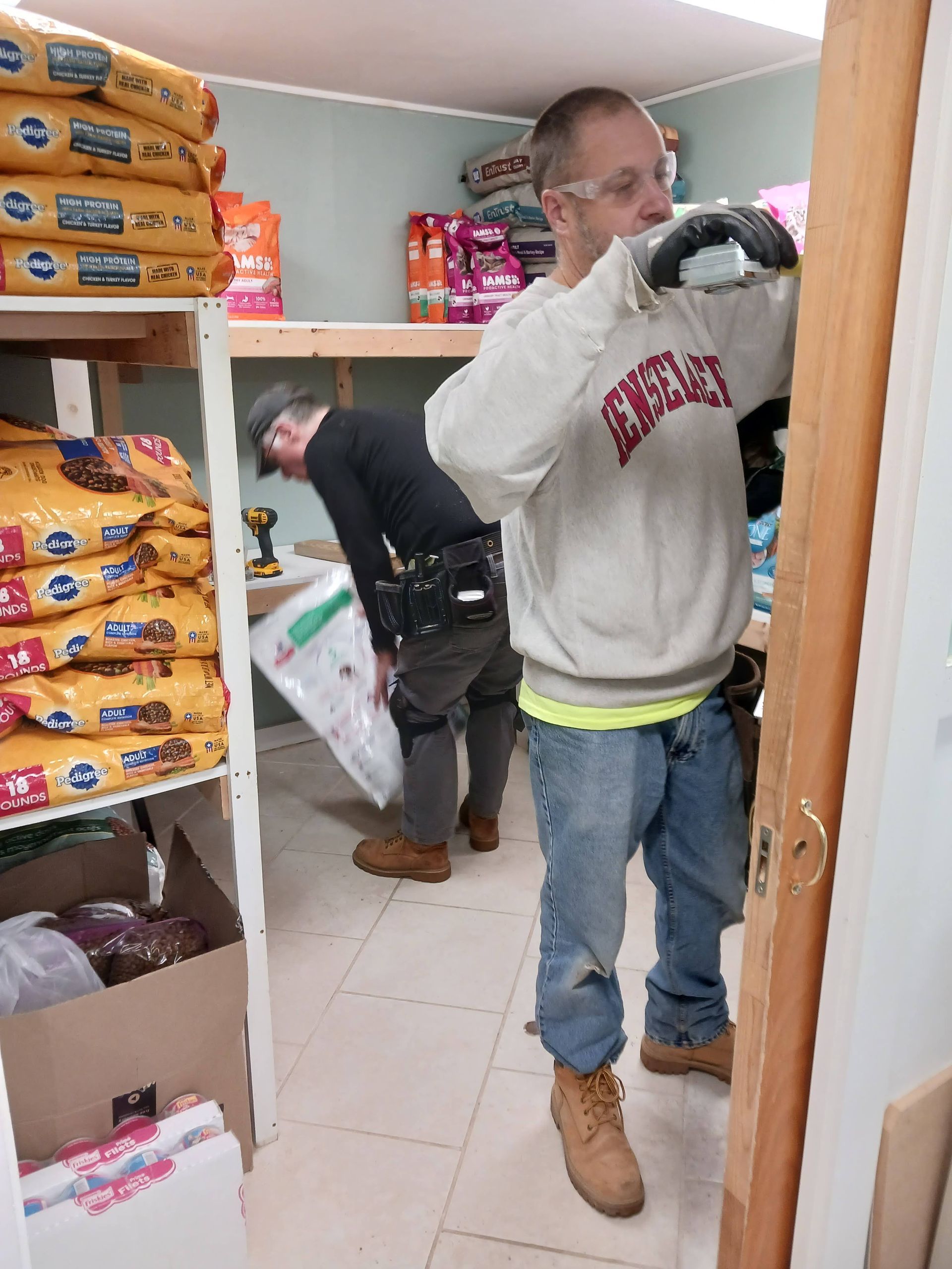 Greg building shelves at Manchester Animal Shelter, Feb. 2024