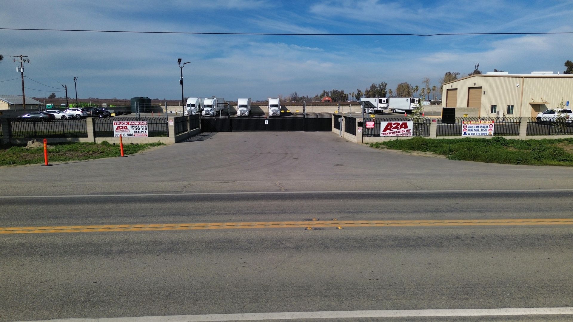 a parking lot with a sign that says 'A2A Transportation Inc.' on it.