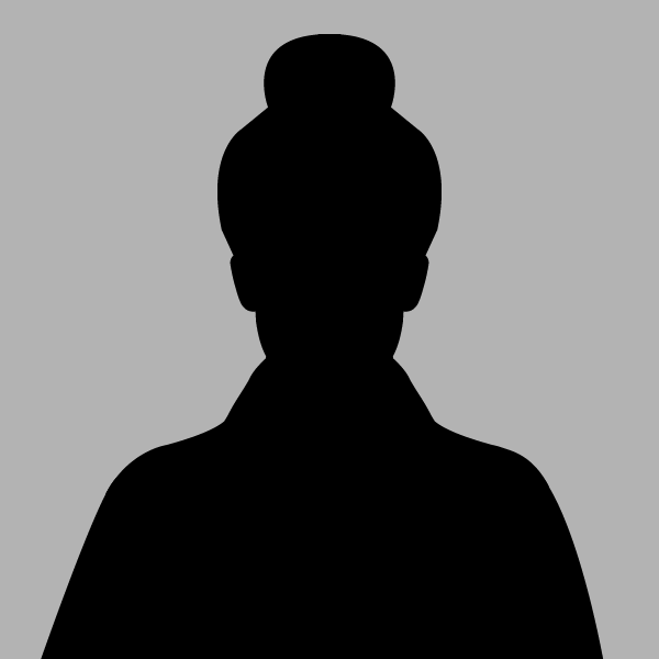 a silhouette of a woman with a bun on her head on gray background.